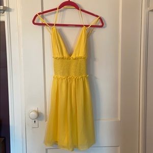 Strappy yellow Bebe mini dress